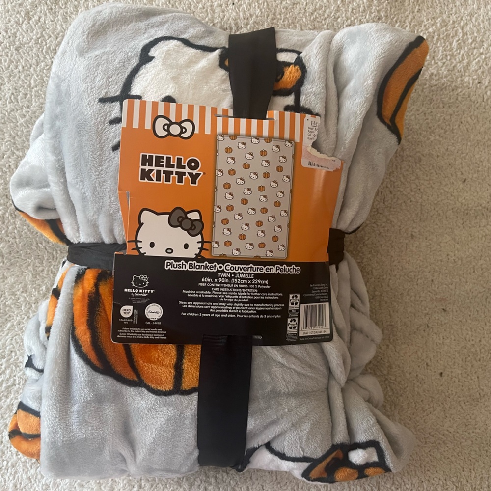 Hello Kitty Plush Blanket in Gray with Pumpkins.